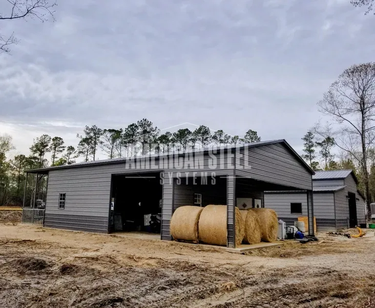 Gray steel barn with open bays