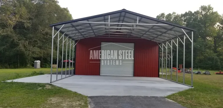 Red steel building with open lean-tos on both sides
