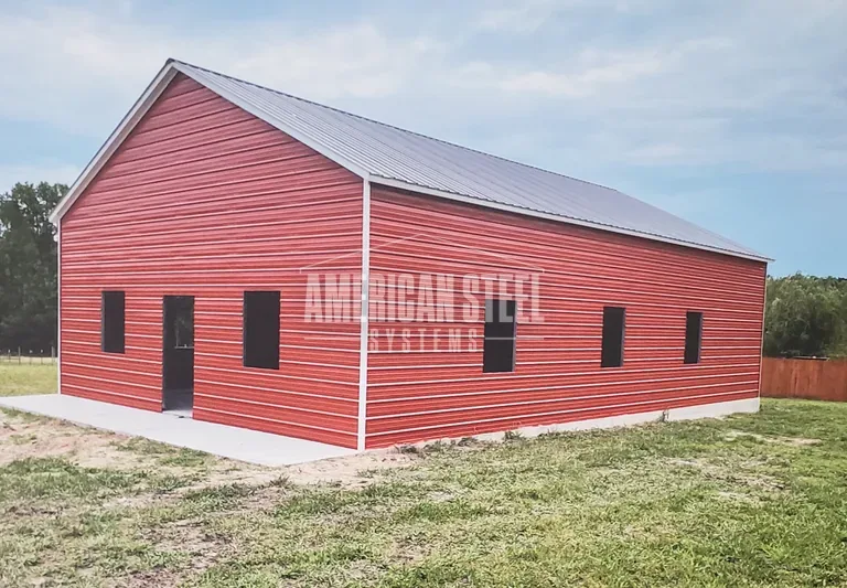Red steel building with white trim