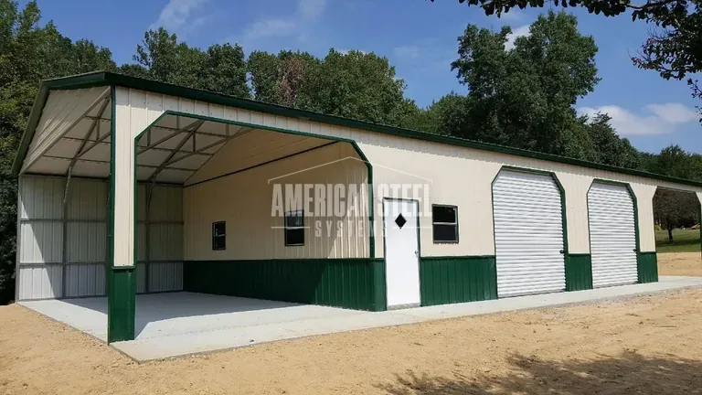 Tan Steel Garage with green trim and open bay