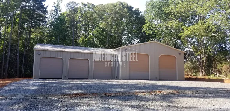 Tan steel building with five garage doors