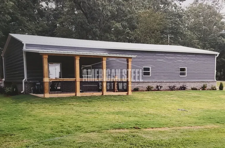 Gray steel building with a wood porch